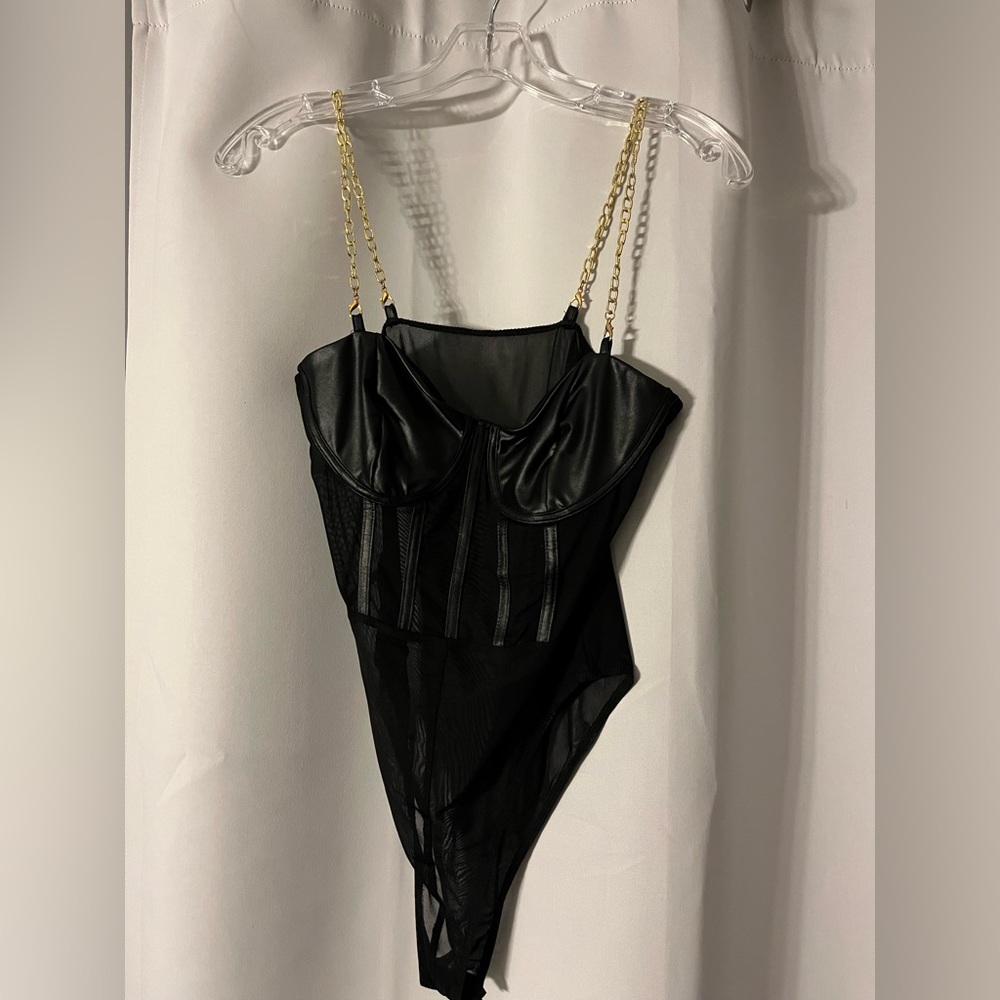 Black body suit, never worn, gold chain. Small.